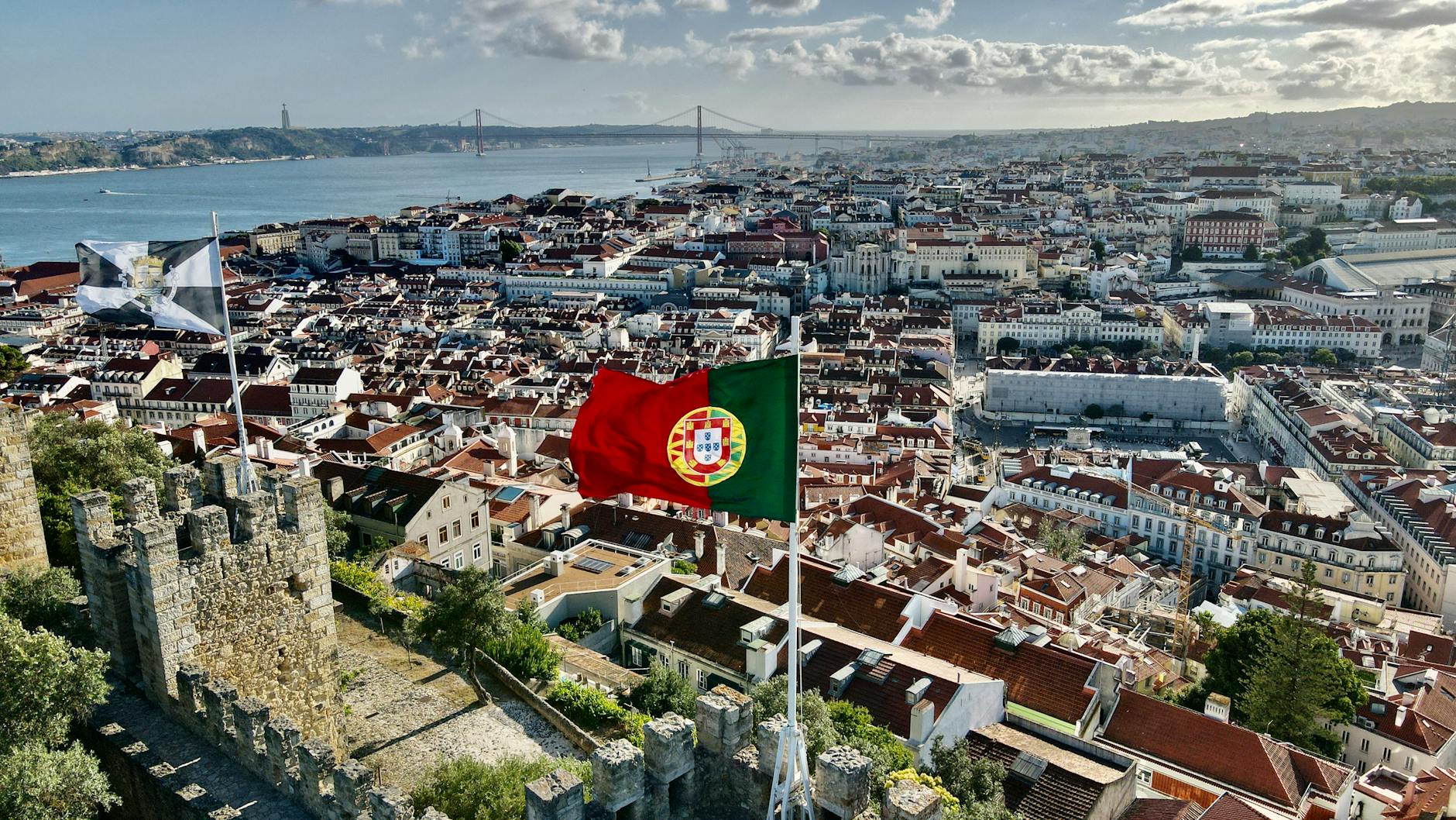 Stunning aerial view of Lisbon cityscape from Saint George's Castle on a sunny day.