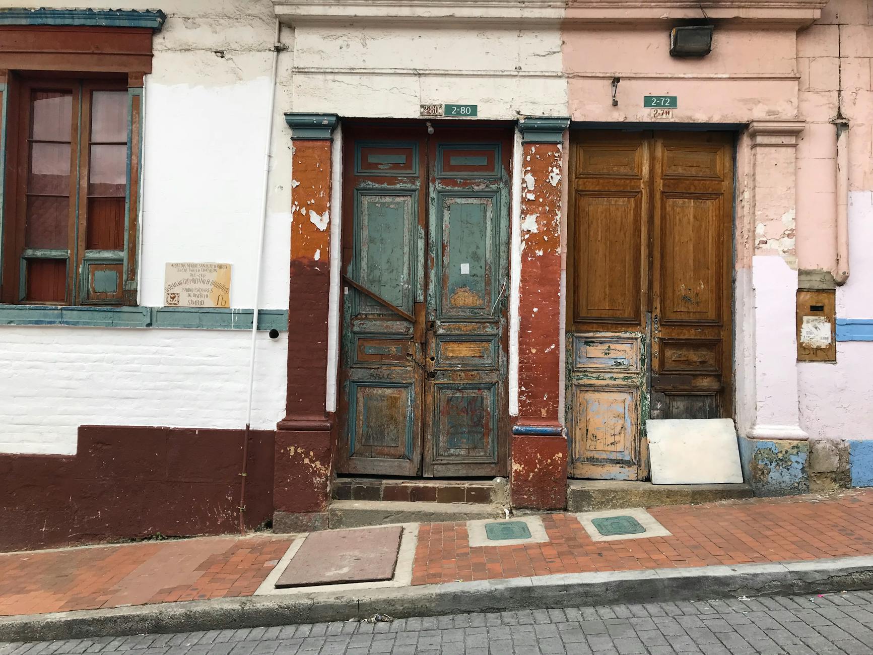 A charming street view of rustic colonial doors in Cundinamarca, Colombia.