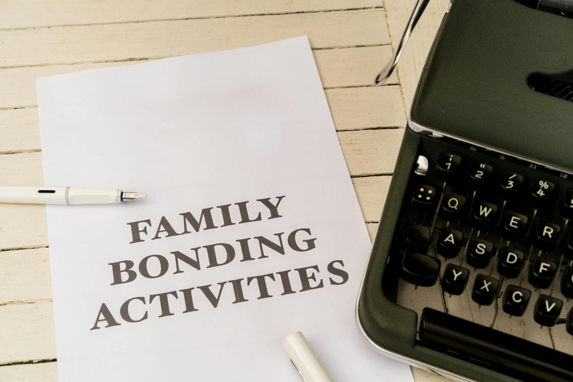 A sheet with 'Family Bonding Activities' next to a vintage typewriter.