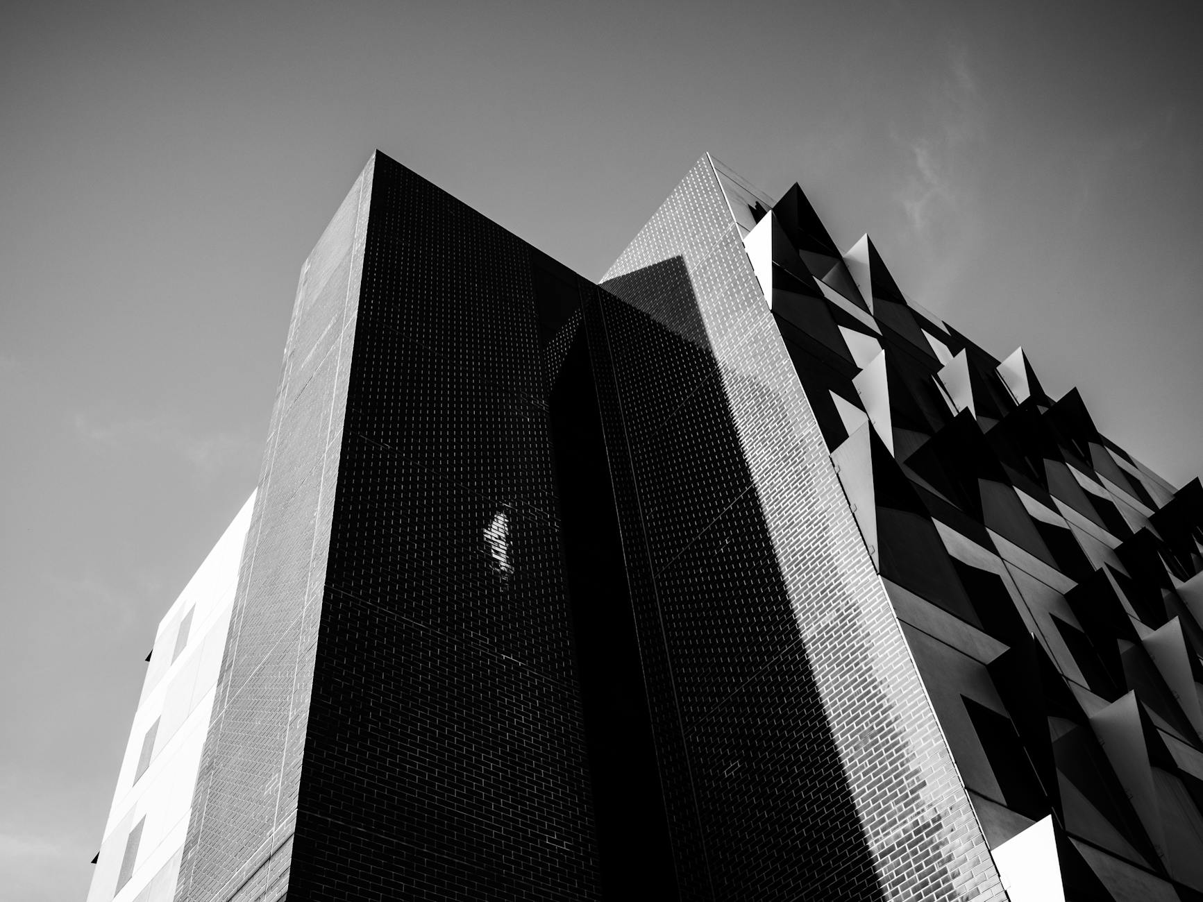 A striking black and white photo of modern architectural design with geometric patterns.