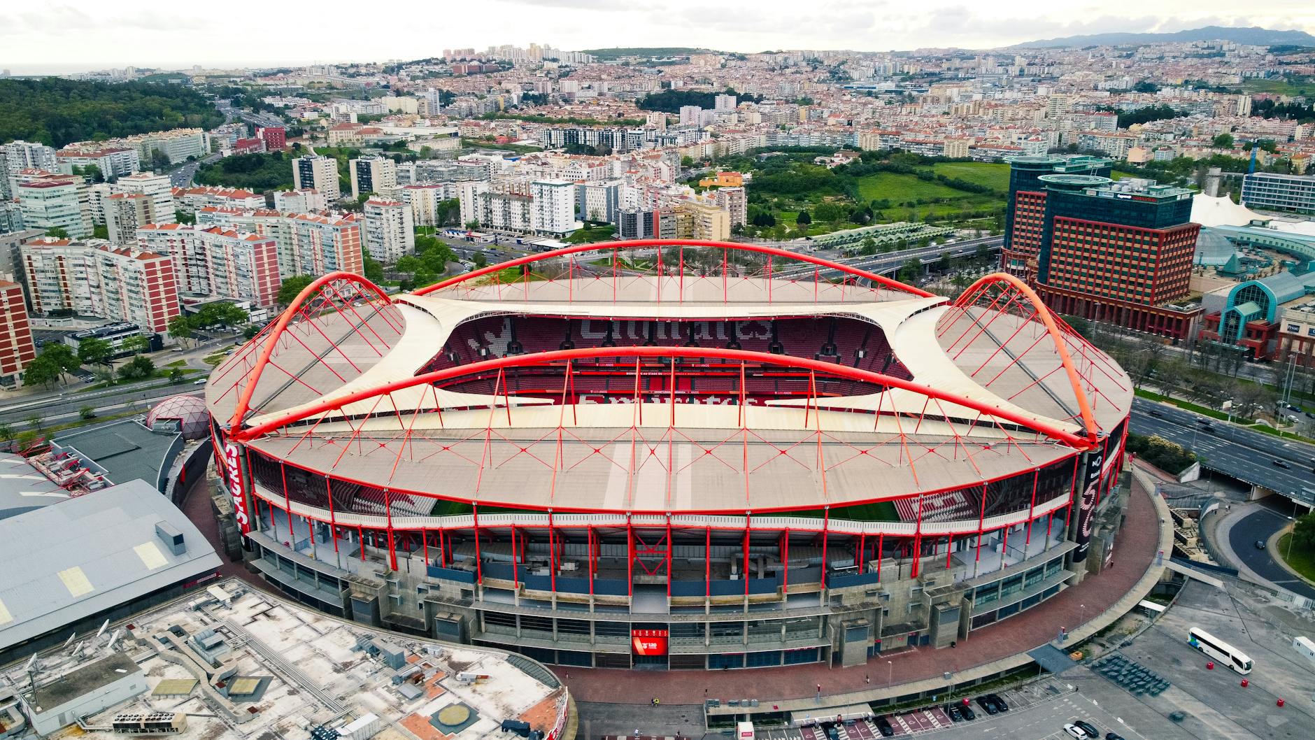 A stunning aerial view of Estádio da Luz stadium in Lisbon, Portugal, showcasing urban landscape and architecture.