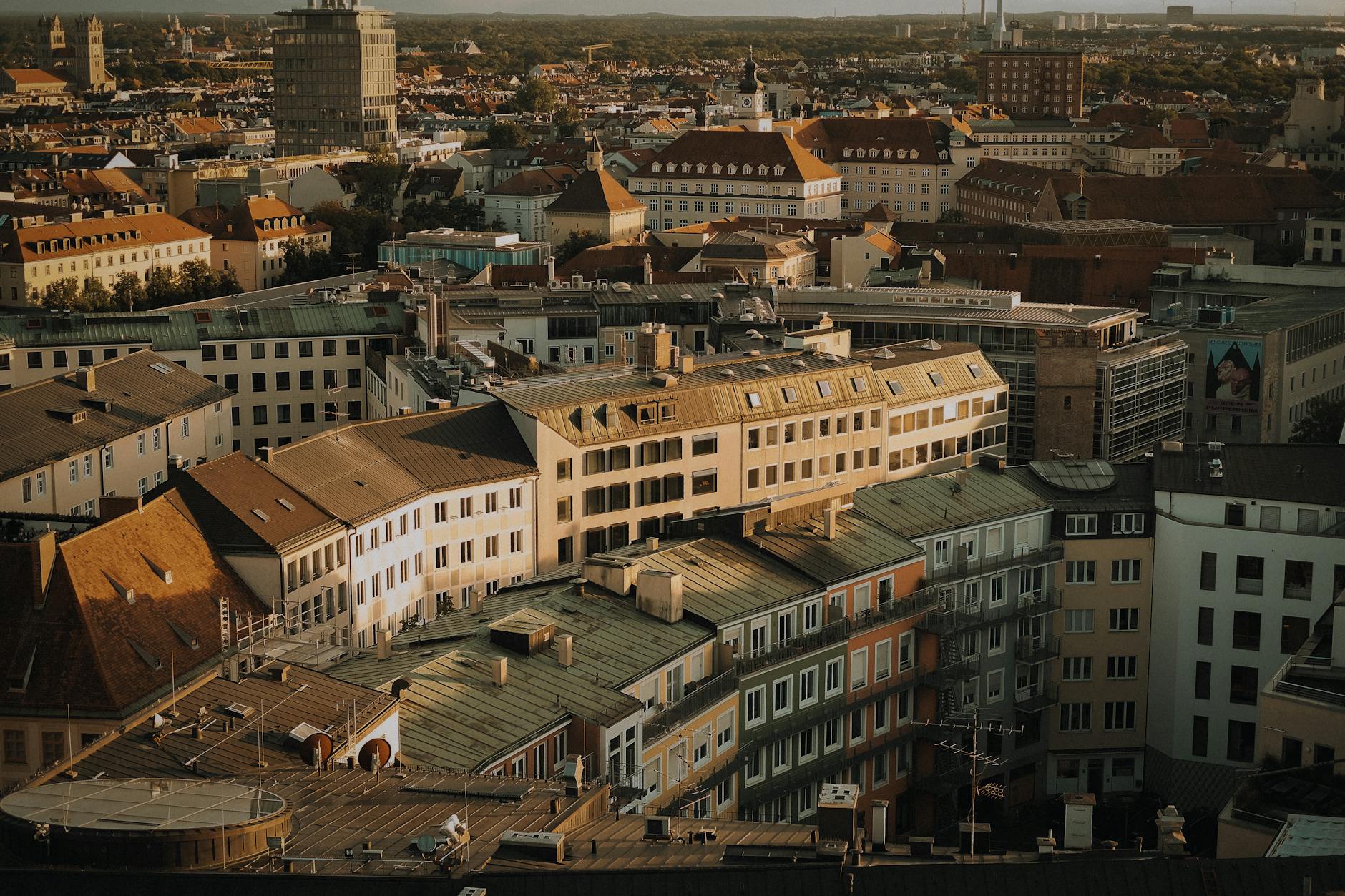 Aerial photo capturing the detailed architecture and rooftops of a dense city area.