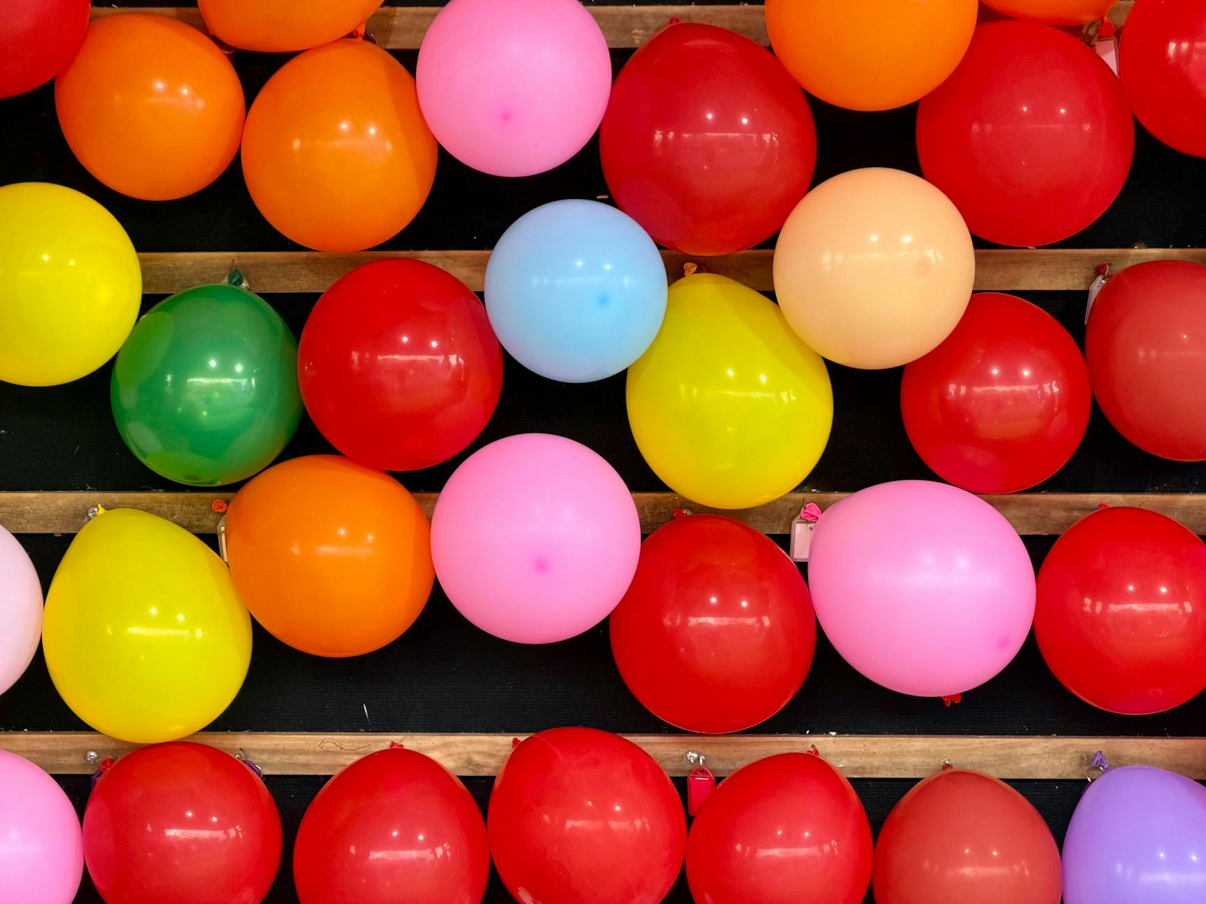 Bright and festive display of colorful balloons at an amusement park in Ascot Vale, Australia.