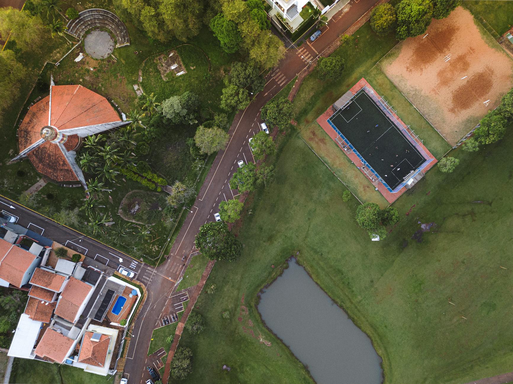 Drone shot capturing the urban landscape and greenery of Campo Mourão, Brazil.
