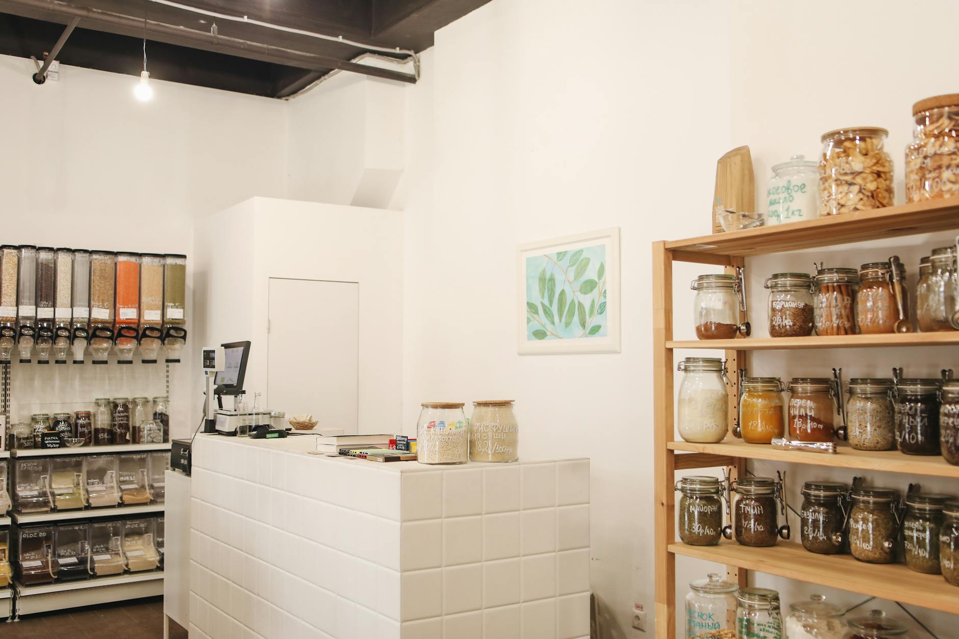 Eco-friendly shop interior featuring wooden shelves and bulk food storage for zero waste shopping.