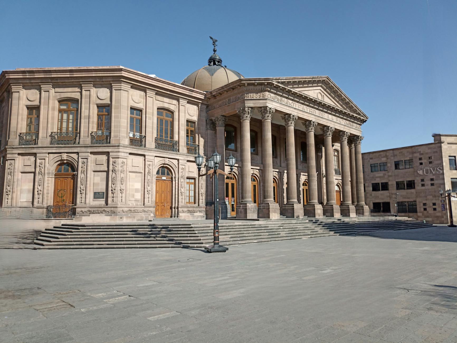 Neoclassical architecture of Teatro de la Paz in San Luis Potosí, showcasing grand columns and historic design.