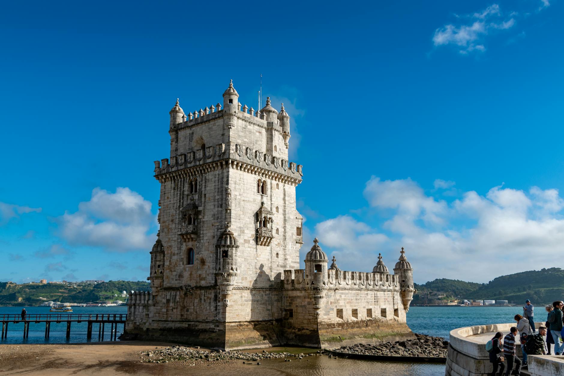 Scenic view of Belem Tower against a blue sky, Lisbon's iconic landmark.