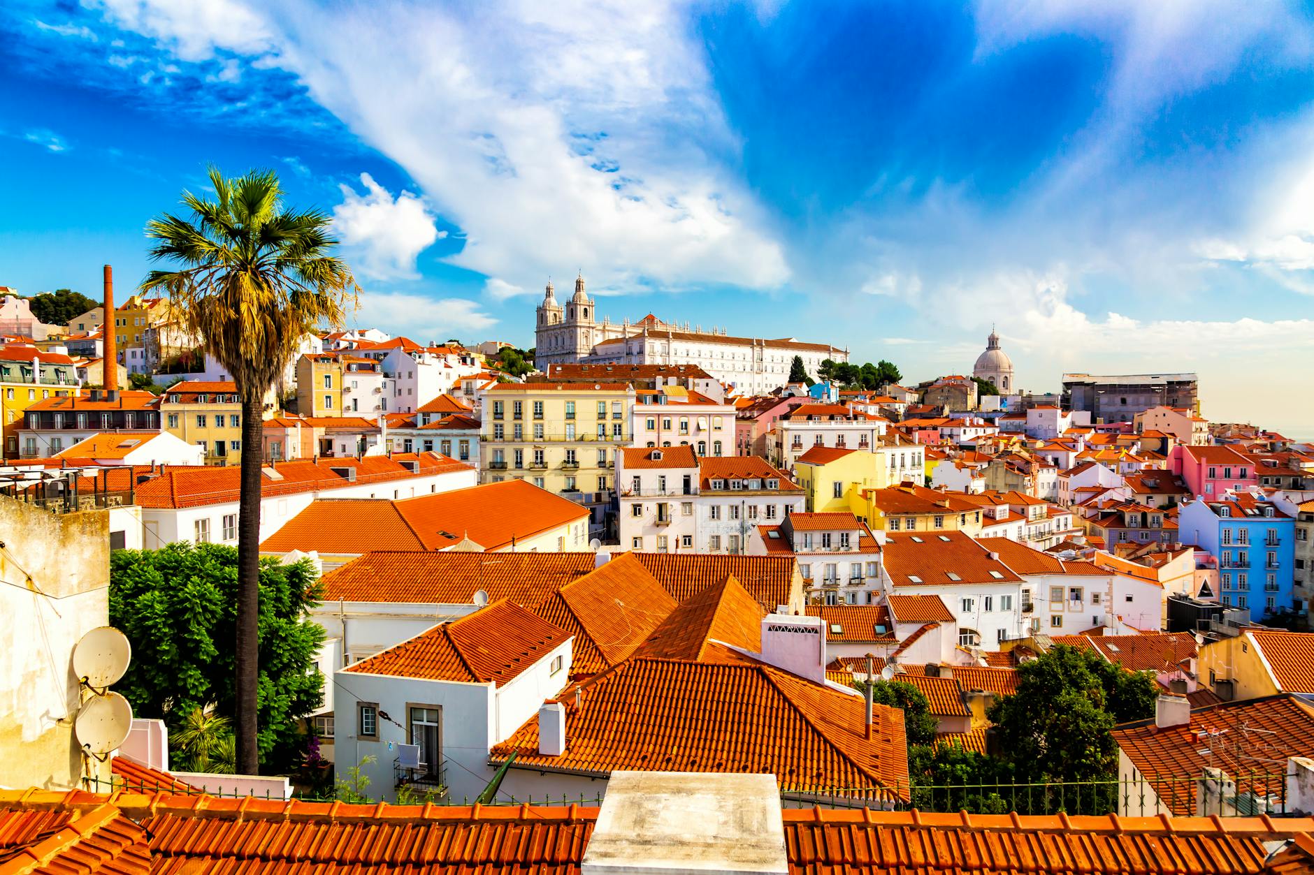 Vibrant rooftops and historic architecture in Lisbon's scenic Alfama district.