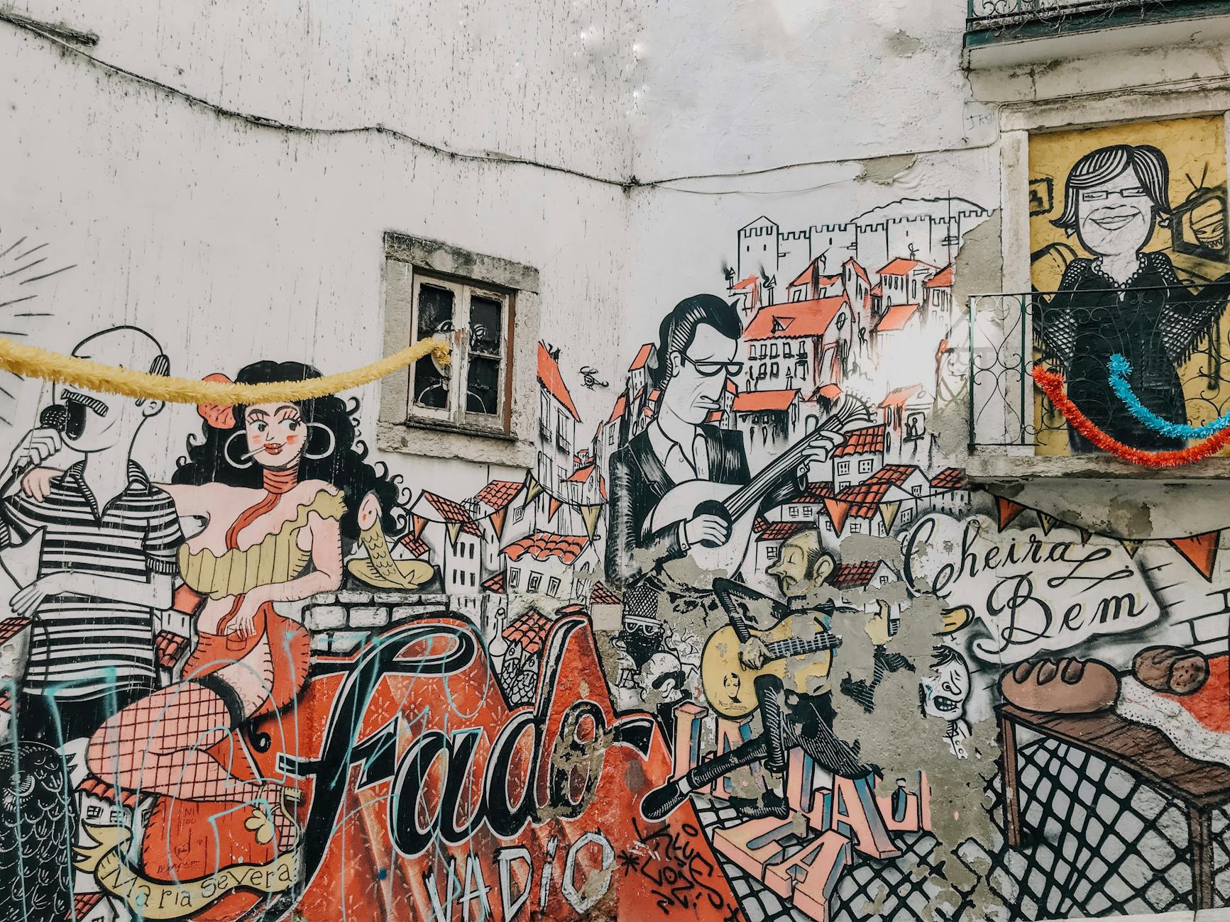 Vibrant street art depicting Fado culture in Alfama, Lisbon. Showcases Portugal's artistic heritage.